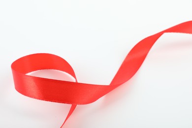 One beautiful red ribbon isolated on white