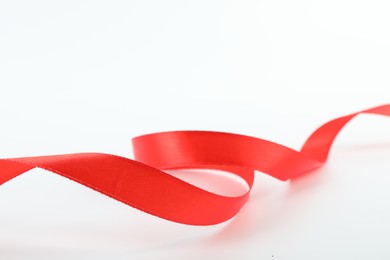 One beautiful red ribbon isolated on white