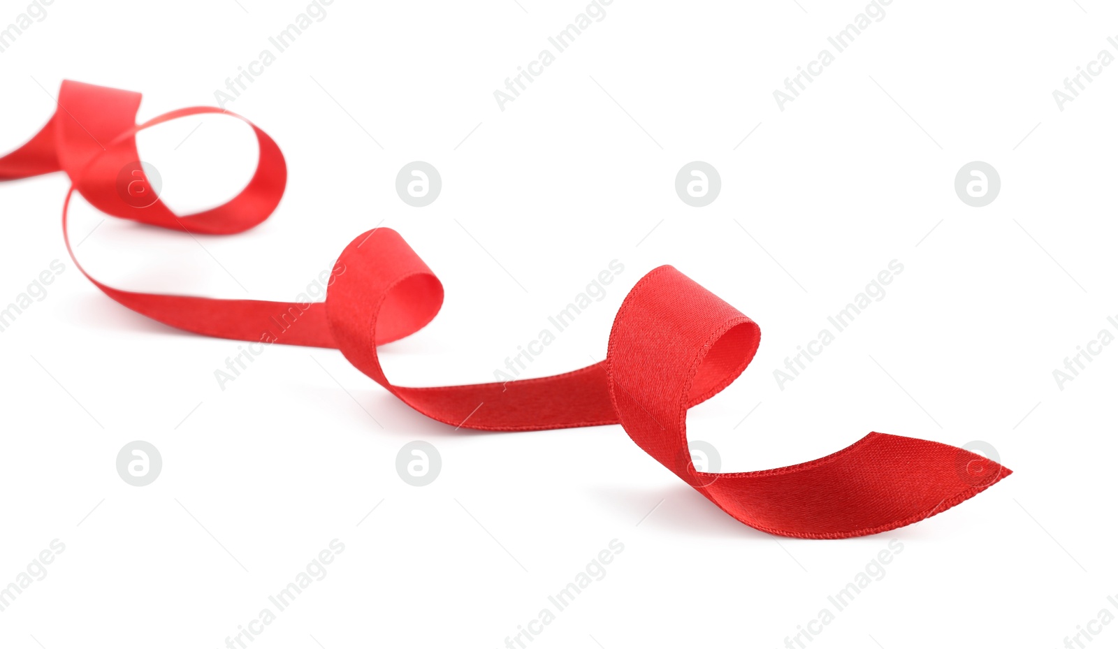 Photo of One beautiful red ribbon isolated on white