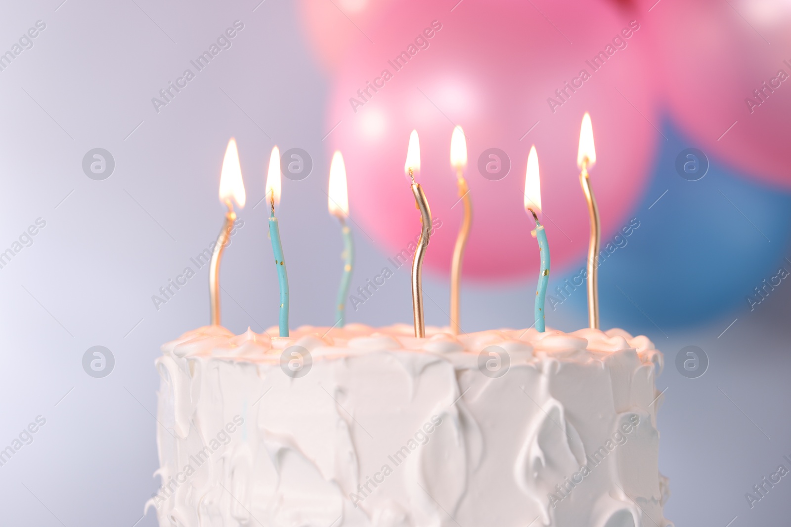 Photo of Tasty Birthday cake with burning candles against blurred background, closeup