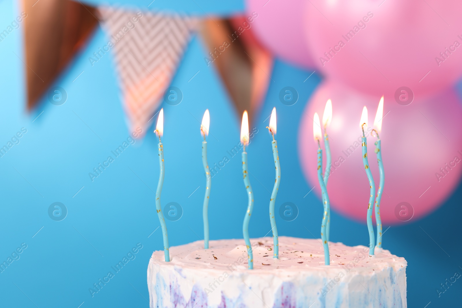 Photo of Tasty Birthday cake with burning candles against blurred background, closeup