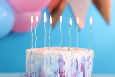 Tasty Birthday cake with burning candles against blurred background, closeup