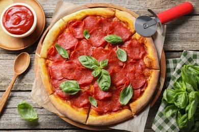 Photo of Flat lay composition with tasty pepperoni pizza on wooden table