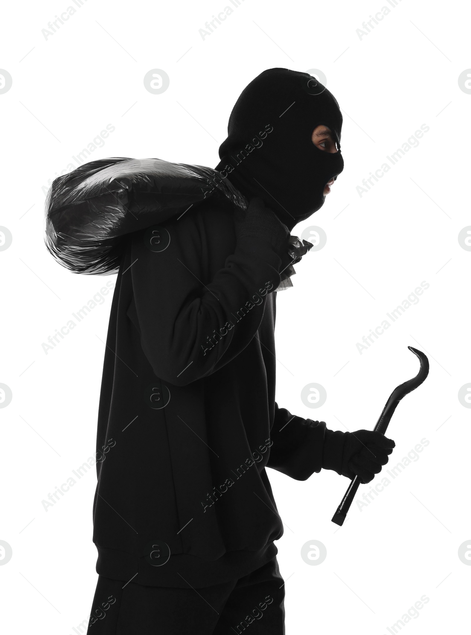 Photo of Thief in balaclava with crowbar and bag on white background