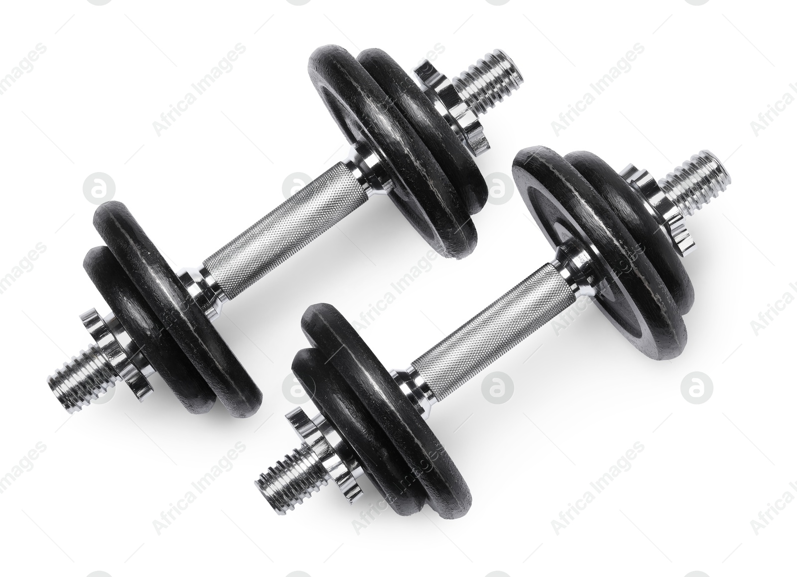 Photo of Metal dumbbells isolated on white, top view. Sports equipment