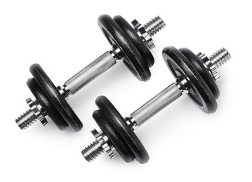 Photo of Metal dumbbells isolated on white, top view. Sports equipment