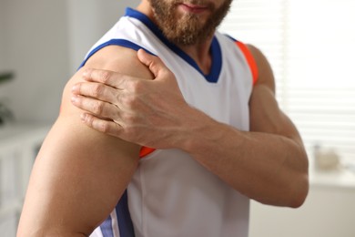 Photo of Sportsman with injured shoulder in hospital, closeup