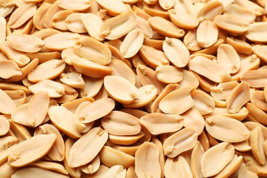 Photo of Fresh peeled peanuts as background, above view