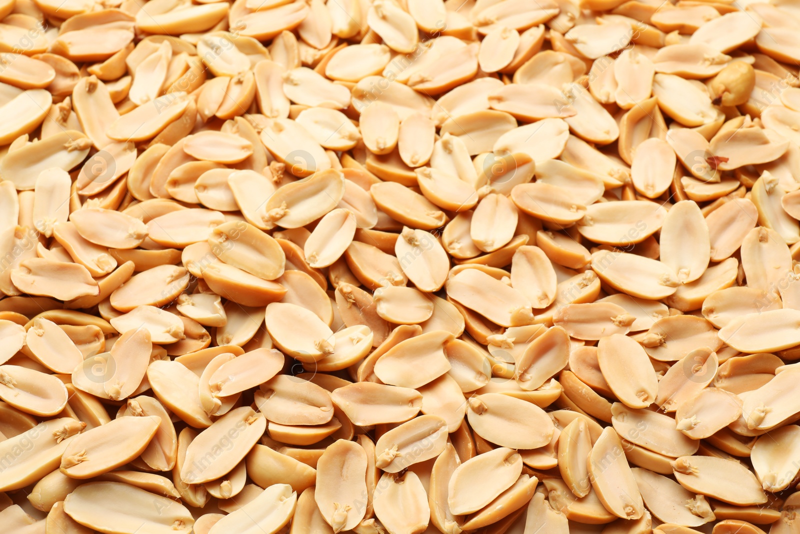 Photo of Fresh peeled peanuts as background, above view