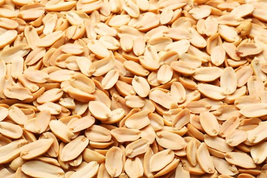 Fresh peeled peanuts as background, above view