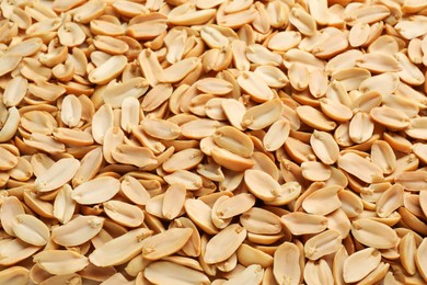 Photo of Fresh peeled peanuts as background, above view