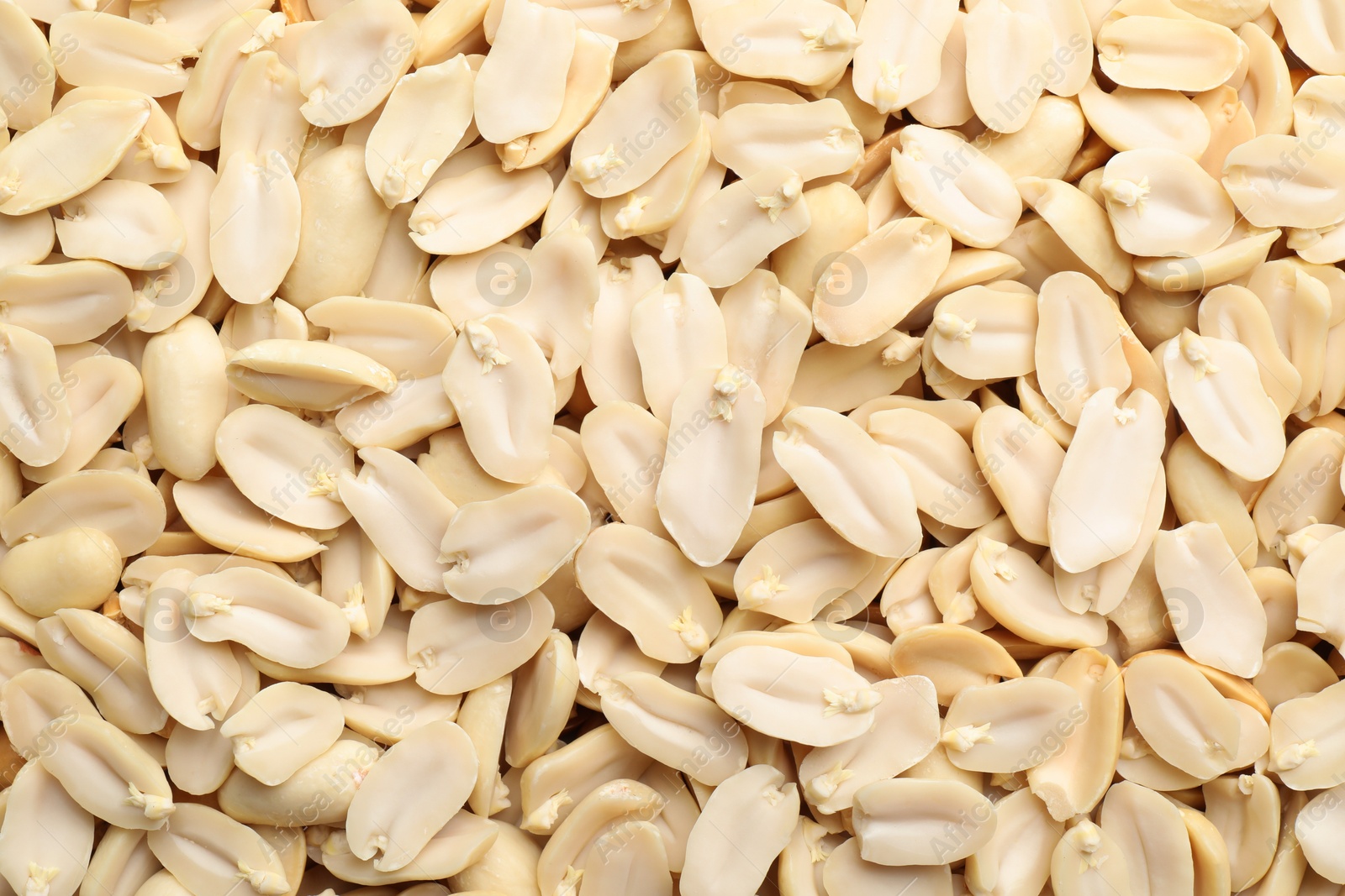 Photo of Fresh peeled peanuts as background, top view