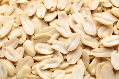 Photo of Fresh peeled peanuts as background, closeup view