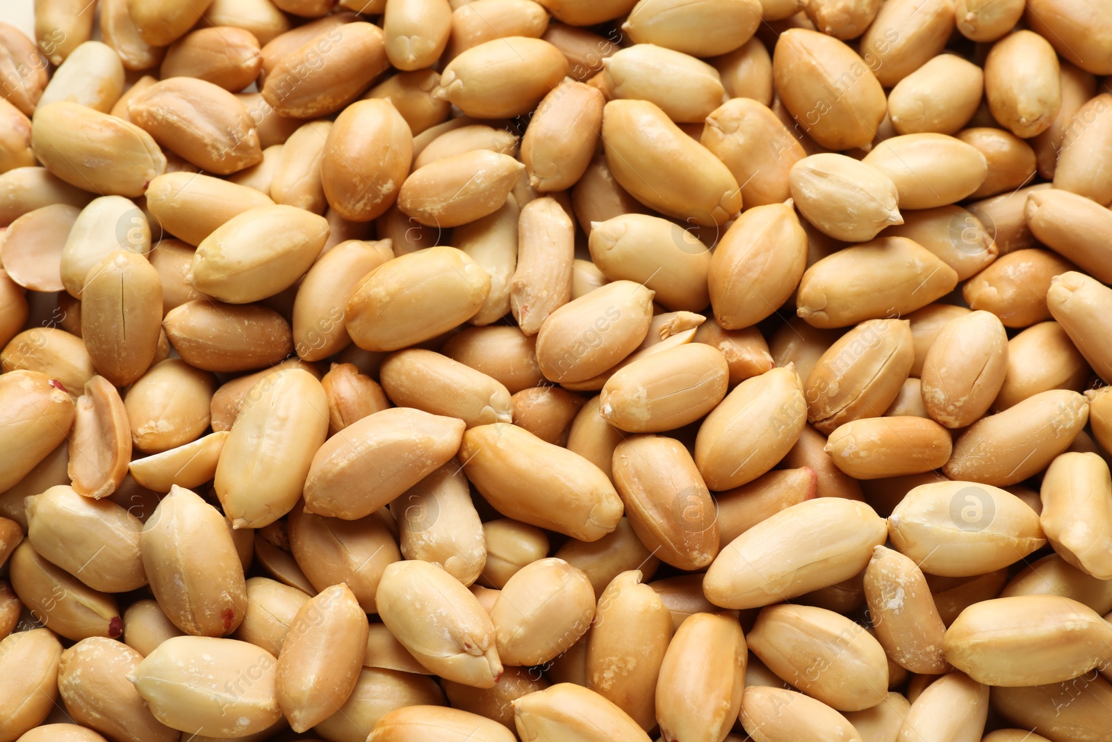 Photo of Fresh peeled peanuts as background, above view