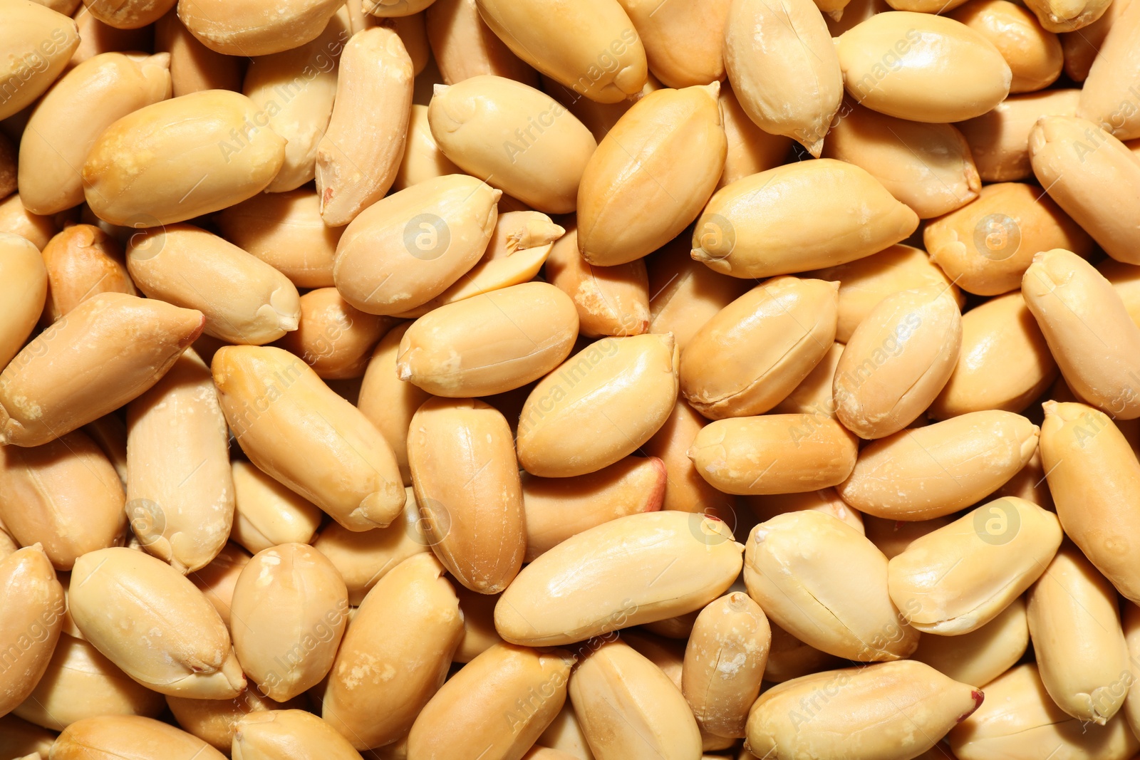 Photo of Fresh peeled peanuts as background, top view