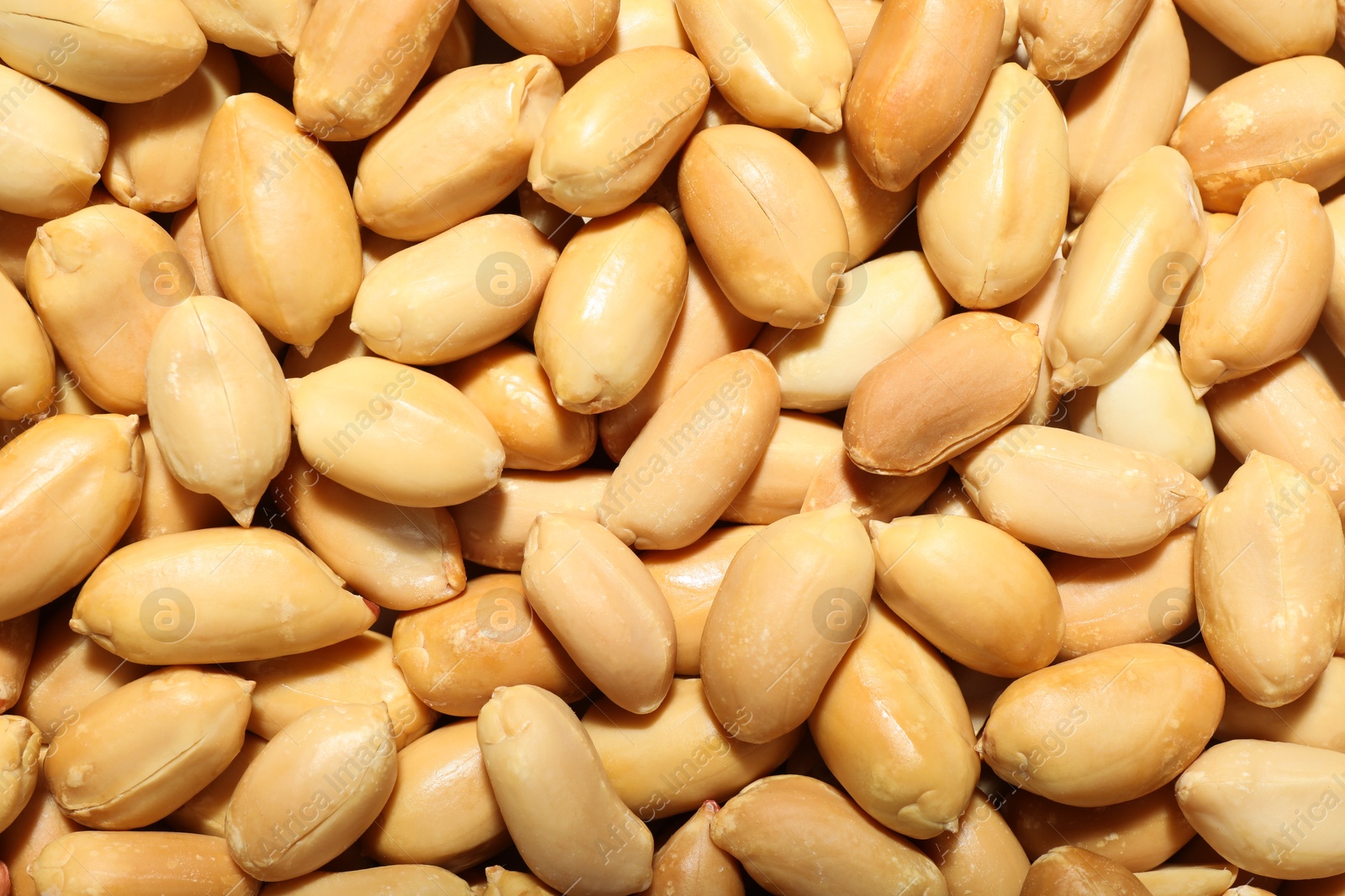 Photo of Fresh peeled peanuts as background, top view