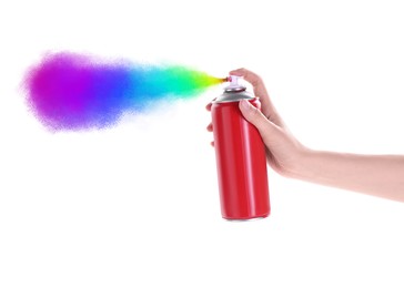 Man spraying colorful paint on white background, closeup