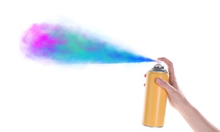 Man spraying colorful paint on white background, closeup