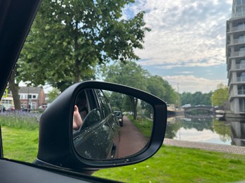 Side view mirror of modern car, closeup