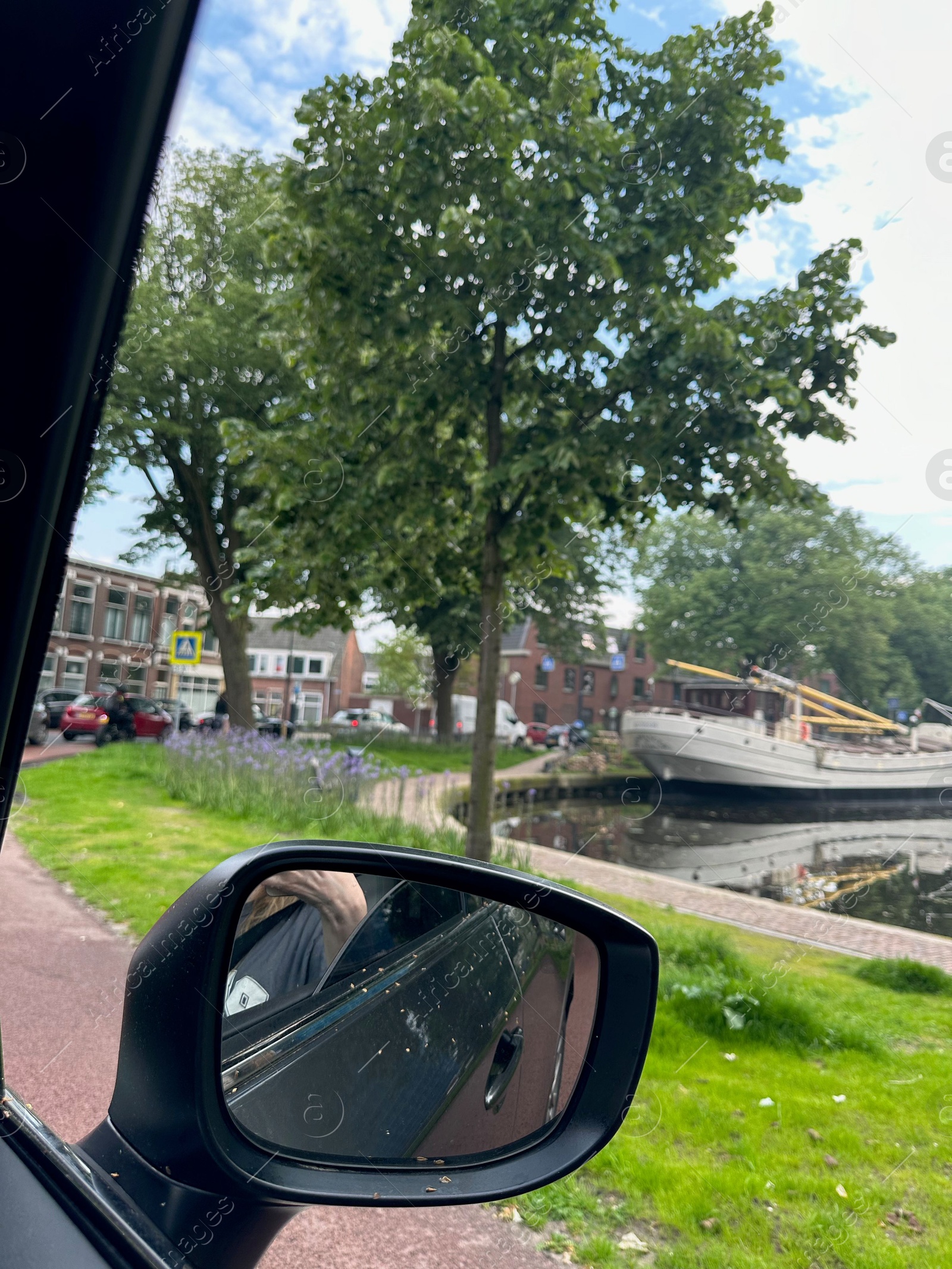 Photo of Side view mirror of modern car, closeup