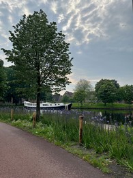 Photo of Beautiful view of canal with moored boat in city