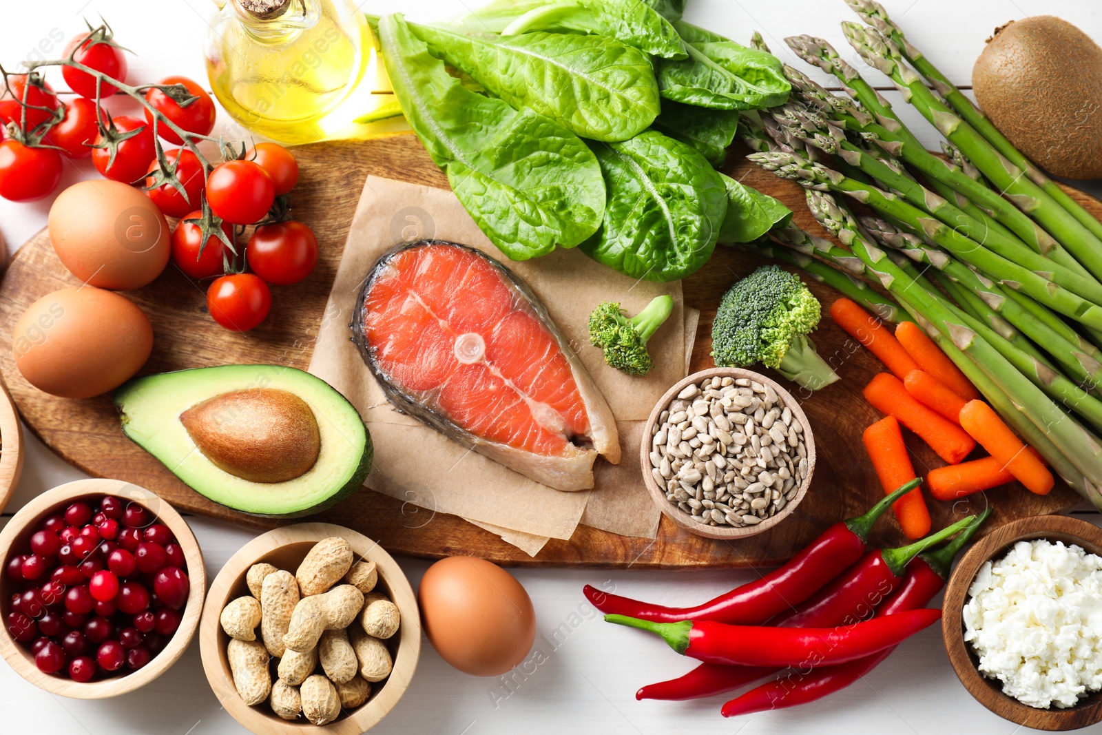 Photo of Many different healthy food on white table, flat lay