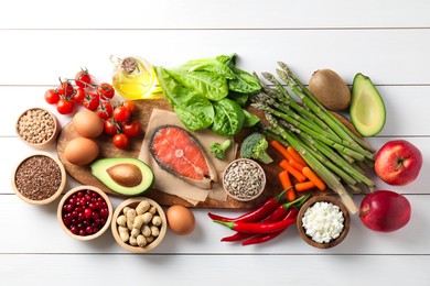 Photo of Many different healthy food on white wooden table, flat lay