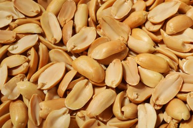 Photo of Fresh peeled peanuts as background, above view