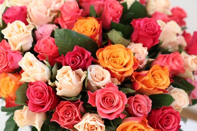Photo of Beautiful bouquet of colorful roses, closeup view
