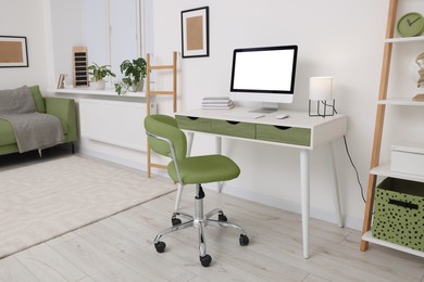 Image of Workplace with comfortable office chair indoors. Interior design