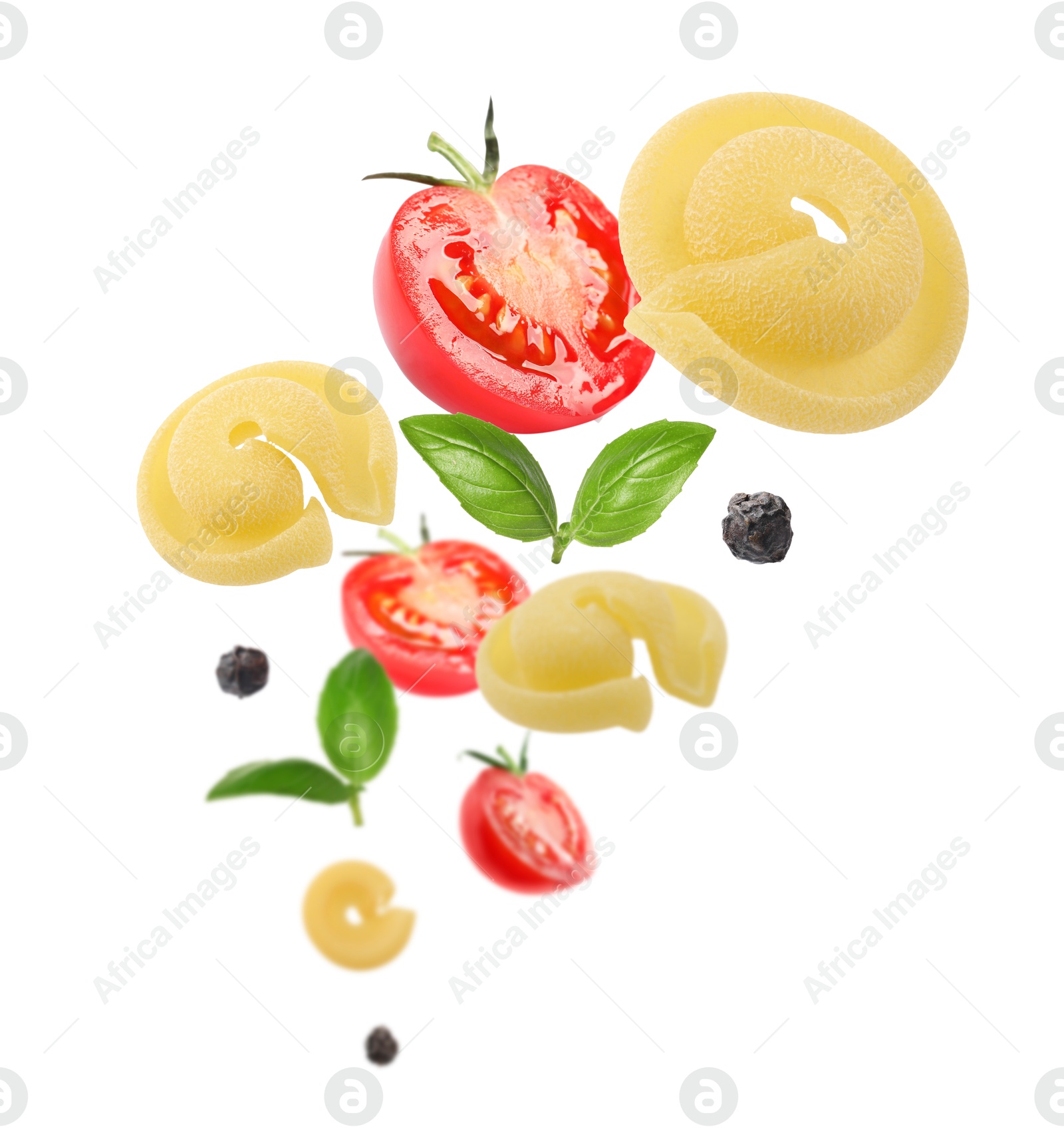 Image of Raw pasta, tomatoes and basil in air on white background