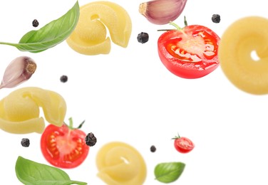 Image of Raw pasta, tomatoes, garlic and basil in air on white background