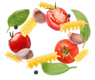 Image of Raw pasta, tomatoes, garlic and basil in air on white background