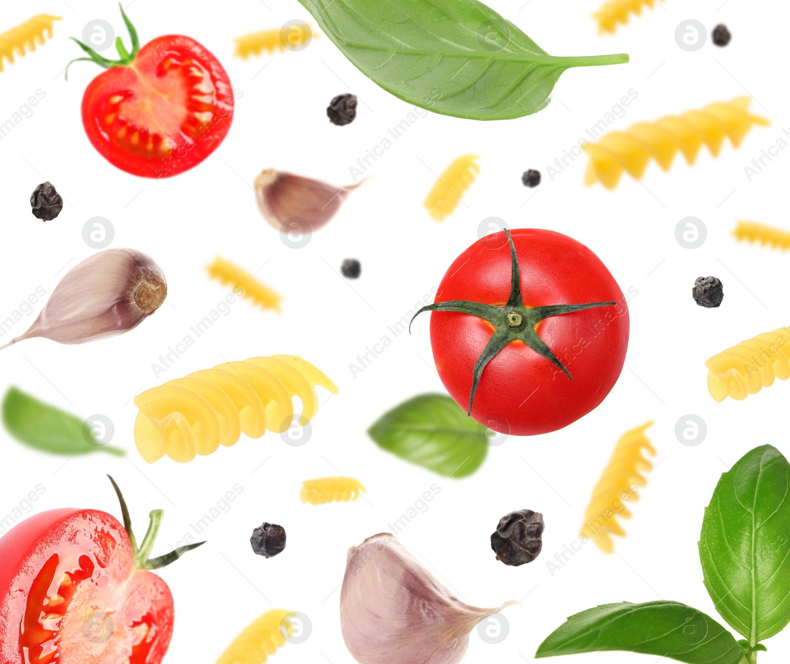 Image of Raw pasta, tomatoes, garlic and basil in air on white background