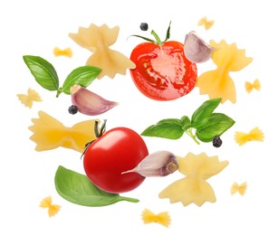 Raw pasta, tomatoes, garlic and basil in air on white background