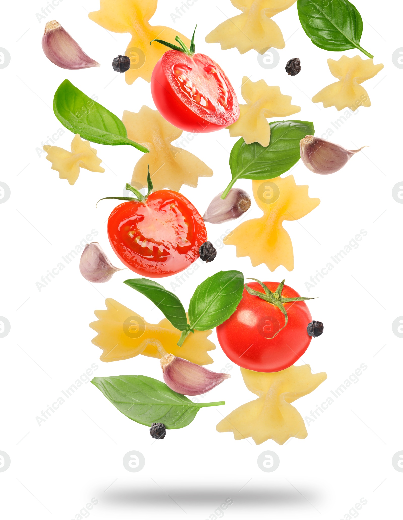 Image of Raw pasta, tomatoes, garlic and basil in air on white background