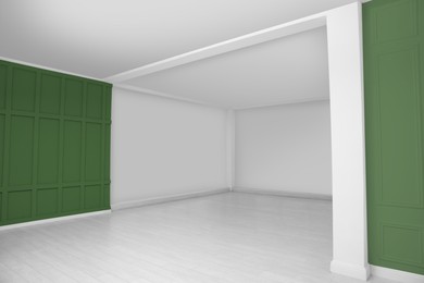 Image of Empty room with white and sage green walls. Interior design