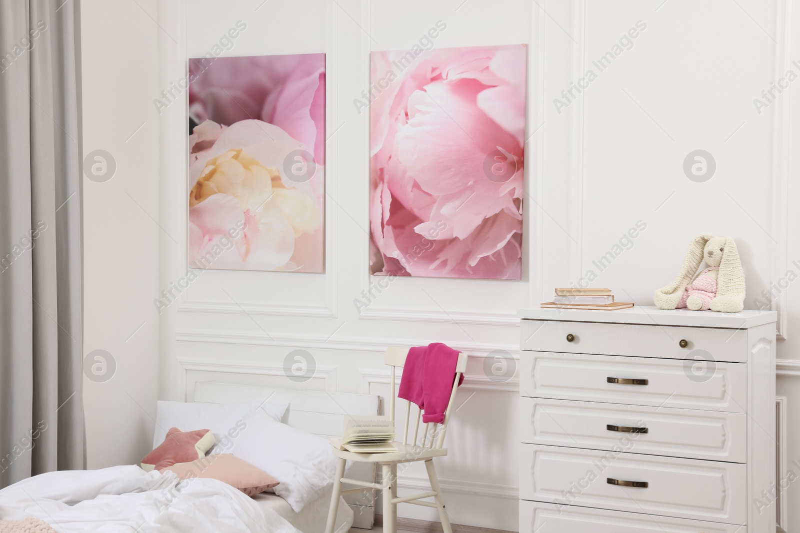 Photo of Cute child's room interior with modern furniture and beautiful pictures of on wall