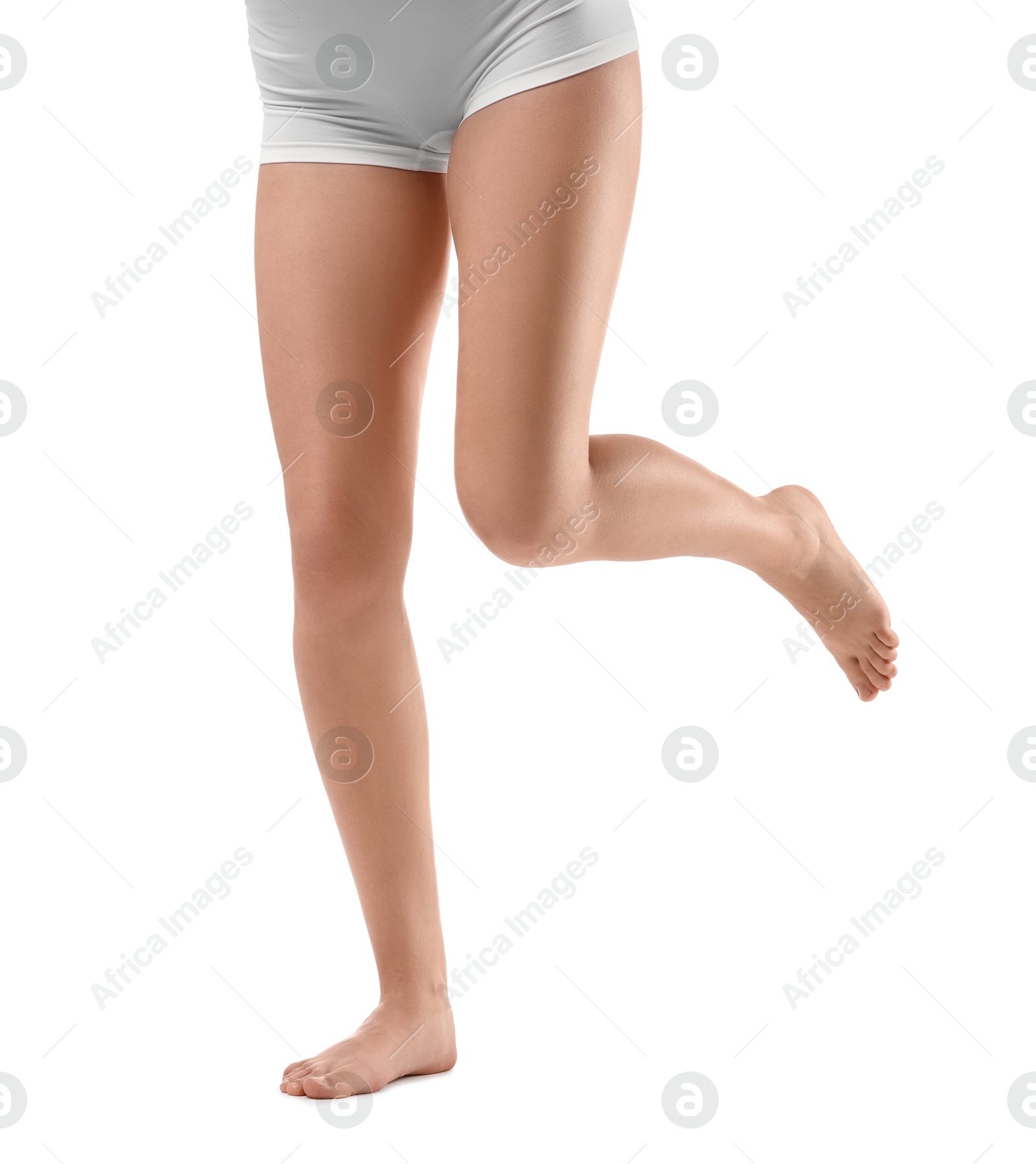 Photo of Woman with slim legs on white background, closeup