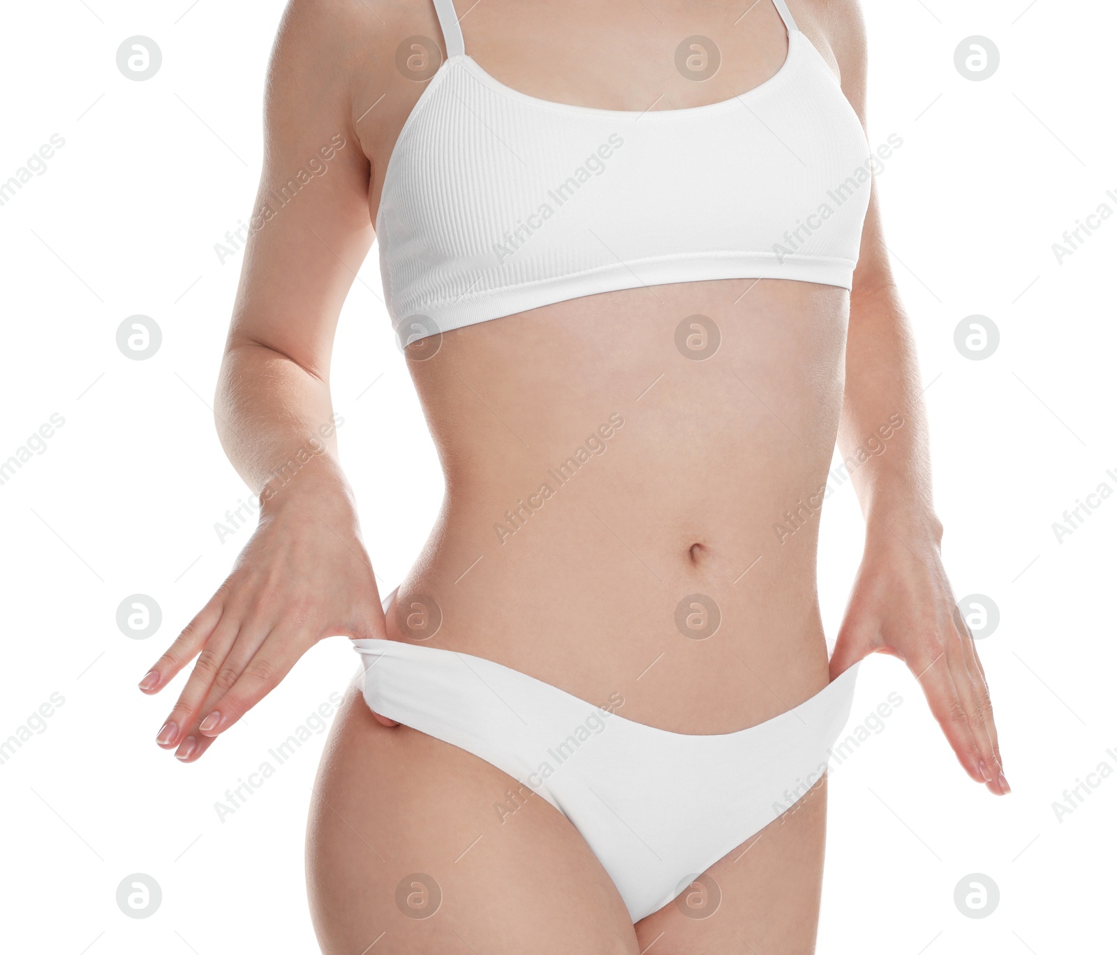 Photo of Woman with slim body posing on white background, closeup