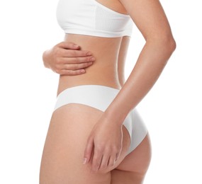 Photo of Woman with slim body posing on white background, closeup