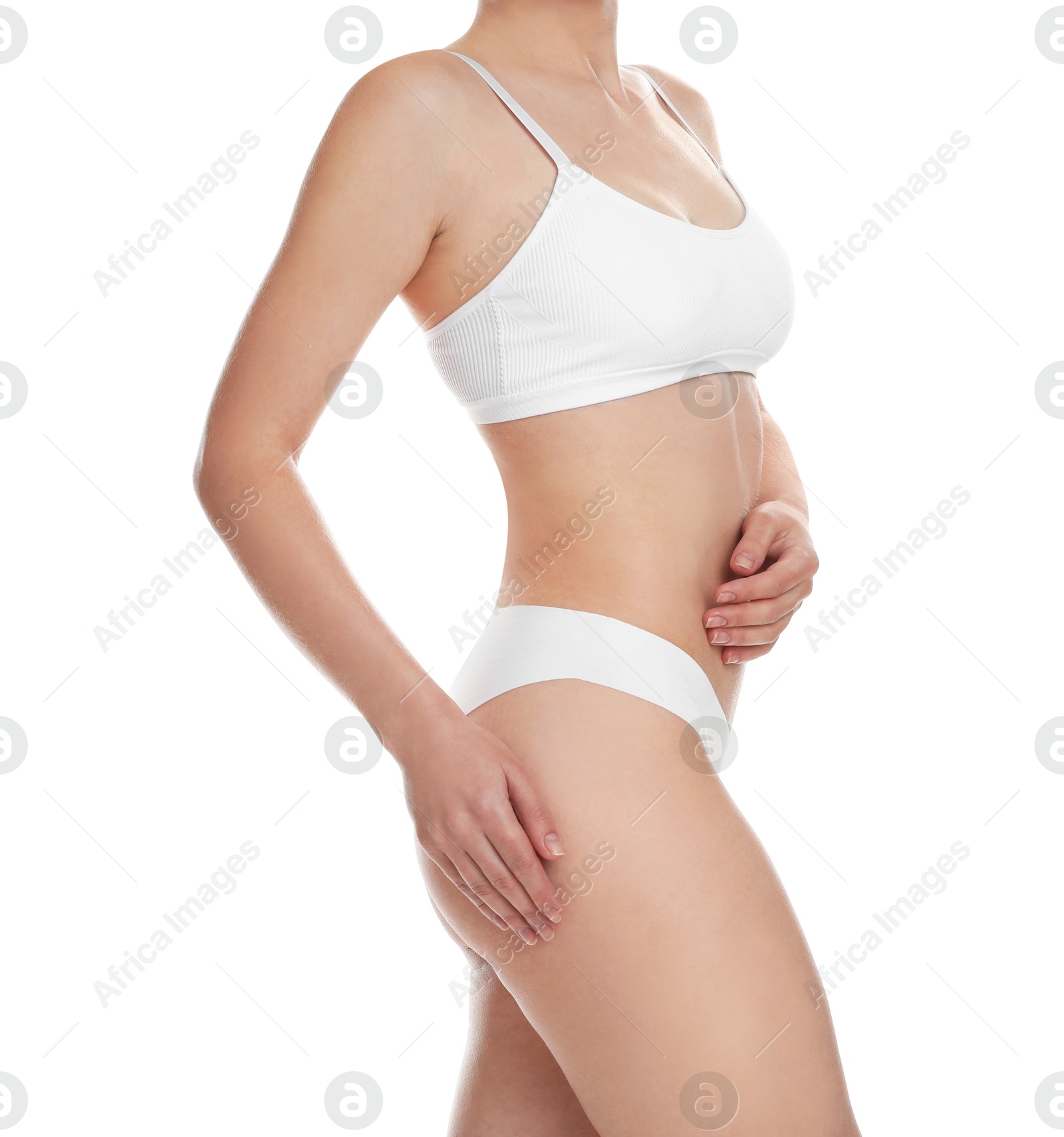 Photo of Woman with slim body posing on white background, closeup