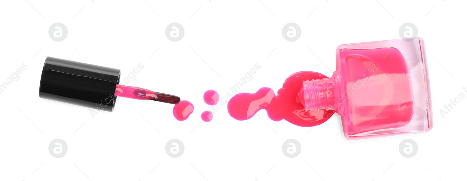 Photo of Bottle, brush and spilled pink nail polish isolated on white, top view