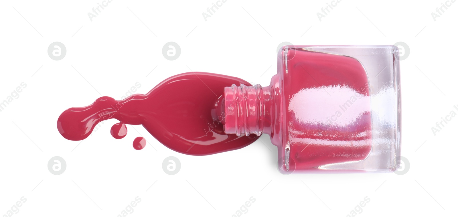 Photo of Bottle and spilled pink nail polish isolated on white, top view