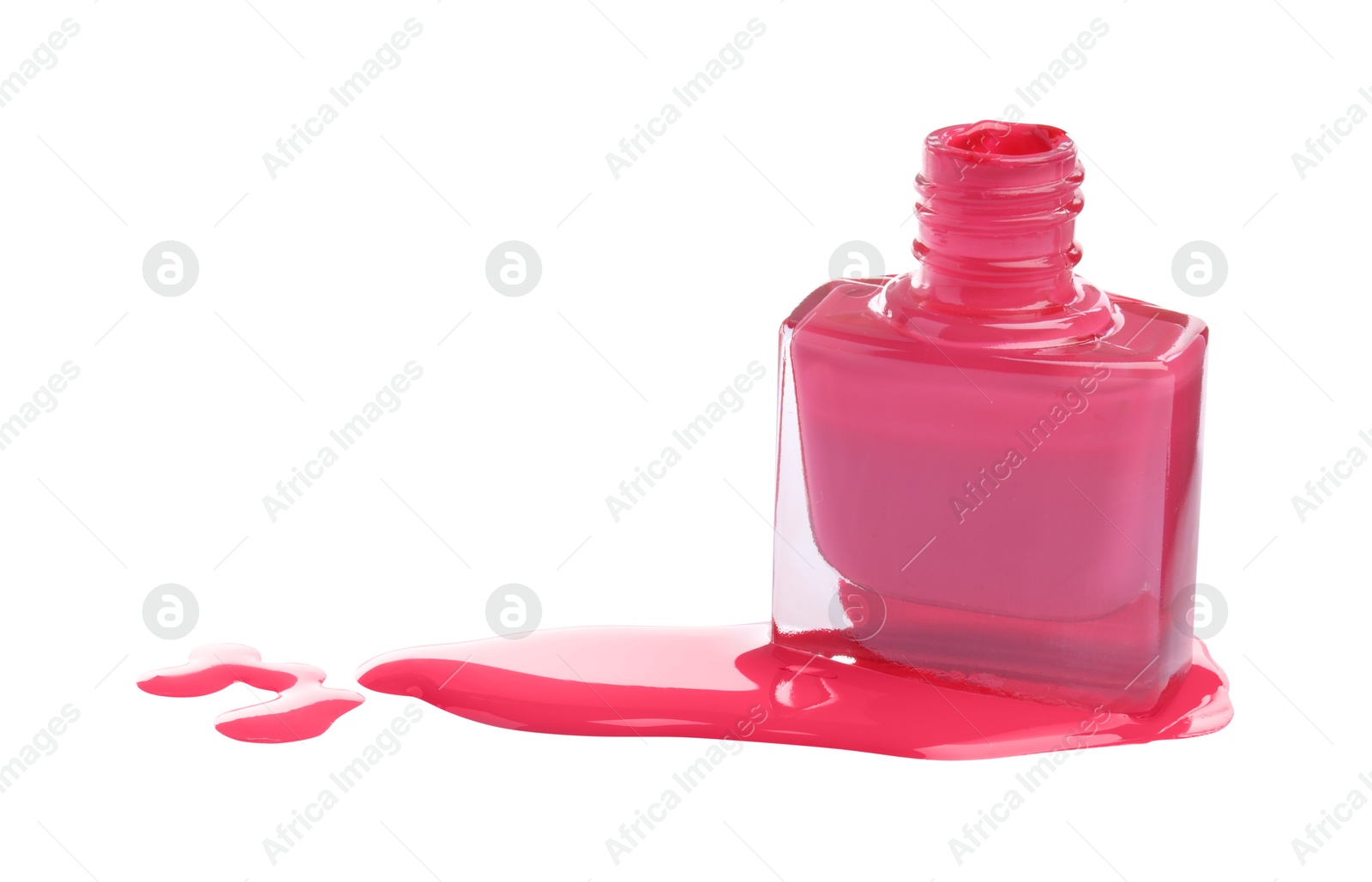 Photo of Bottle and spilled pink nail polish isolated on white