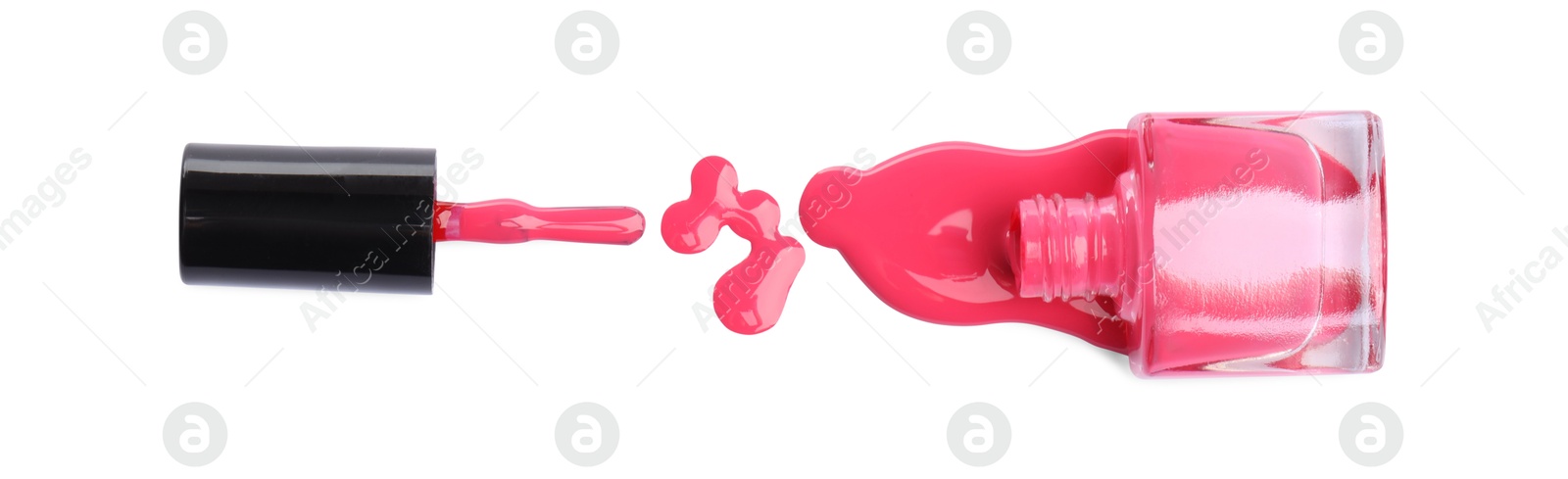 Photo of Bottle and brush with spilled pink nail polish isolated on white, top view