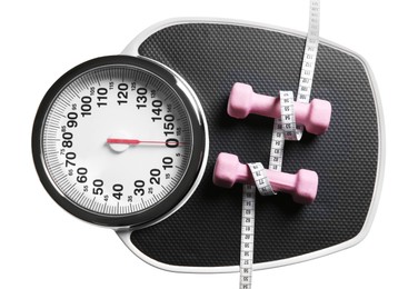 Photo of Bathroom scale, measuring tape and dumbbells isolated on white, top view