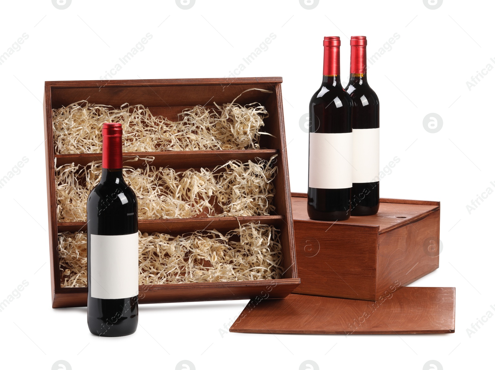 Photo of Wooden gift boxes with wine bottles isolated on white