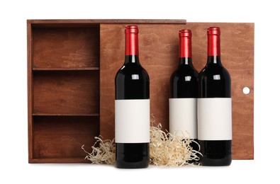 Wooden gift box with wine bottles isolated on white