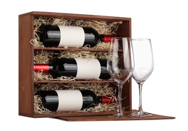 Wooden gift box with wine bottles and glasses isolated on white